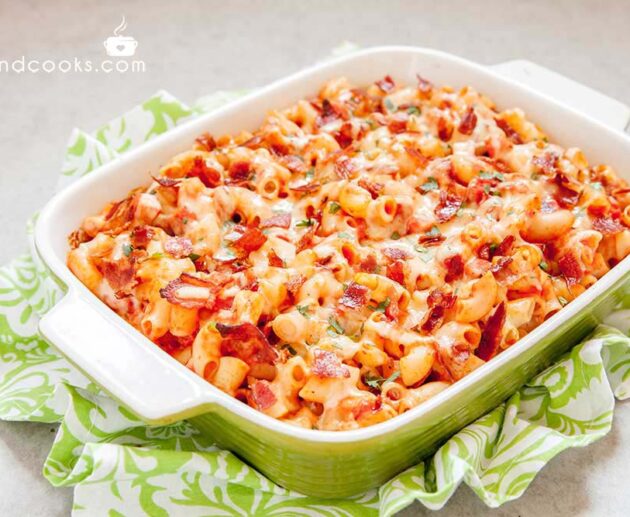 Pasta casserole with bacon, ham, cheese and tomato