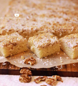 Fluffy cake with coconut and walnut topping